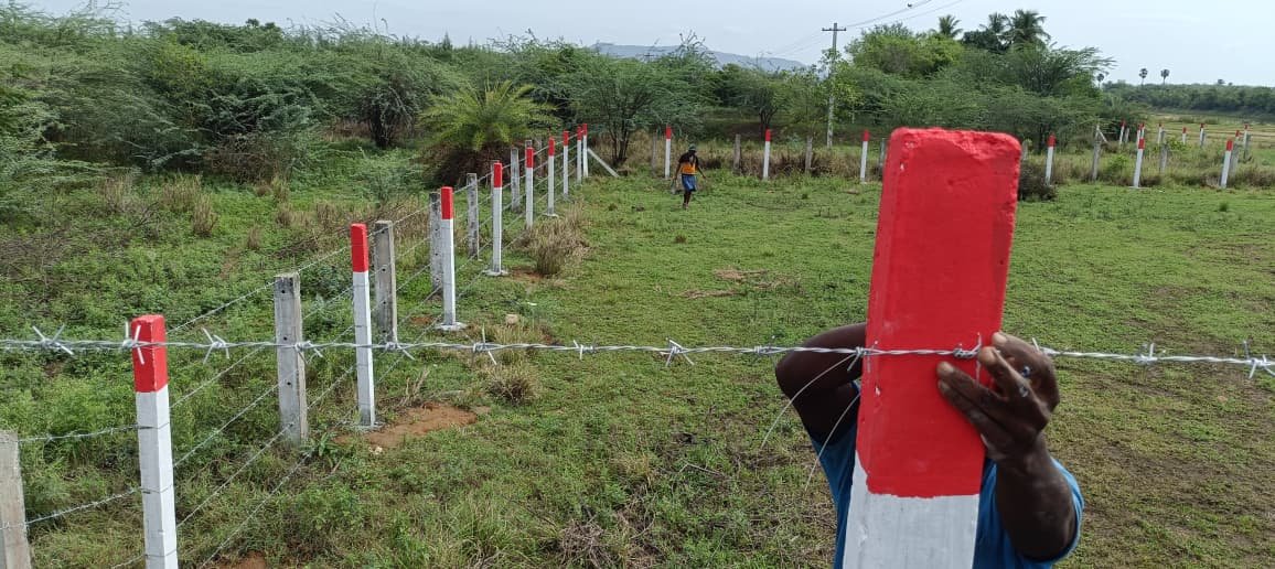 Red and white post wire fence, Chennai